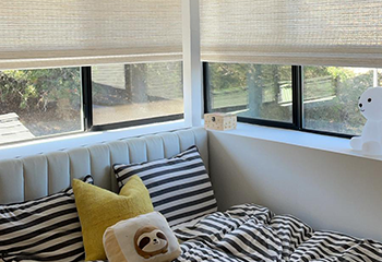 Space with white bamboo shades adding chic sophistication